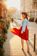 © Катя Іваськевич - young woman walking on the street in a dress