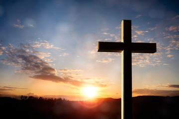 Sticker - Crucifix cross at sunset background, crucifixion of Jesus Christ