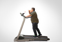 Young Boy Walking On The Treadmill While Eating A Slice Of Pizza. (Obesity) 	
