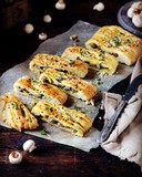 Fototapeta Desenie - Homemade yeast pie with mushrooms on a dark wooden background, rustic style