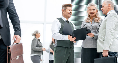 Canvas Print - close up. group of employees discussing documents standing in the office