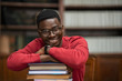 © Rido - African student on pile of books