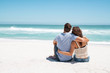 © Rido - Couple embracing and sitting on beach