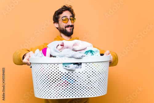 Cuadros en Lienzo young crazy cool man with the laundry basket