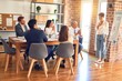 © Krakenimages.com - Group of business workers working together in a meeting. One of them making presentation to colleagues at the office