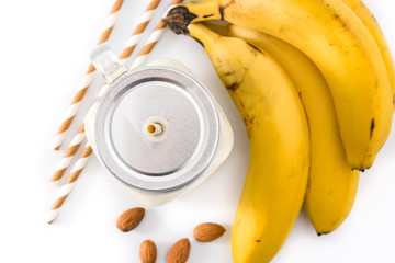 Wall Mural - Banana smoothie with almond in jar isolated on white background. Top view	