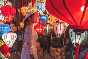 Travel woman choosing lanterns in Hoi An, Vietnam