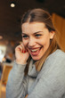 © qunica.com - Portrait of a pretty blonde girl sitting in a comfortable coffee shop during a work break, Close up photo of a beautiful female with blue eyes.