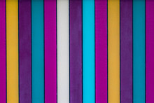 A Fun Brightly Colored Stripey Background With Blues, Whites, Purples, Yellows And Teal Shades In Vertical Stripes