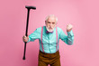 Shut up. Photo of aggressive aged man raise walking cane fist angry grimace blaming neighbor kids for noise wear shirt suspenders bow tie trousers isolated pink pastel background