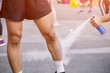 © PRASERT - Sports doctor treating injured sportman's leg