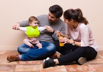 Baby and parents having lunch