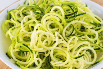 Wall Mural - Spiral zucchini noodles salad with variety vegetables.