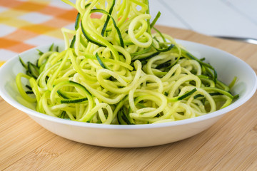 Wall Mural - Spiral zucchini noodles salad with variety vegetables.