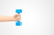© Foxstudio - Cartoon hand holding small blue dumbbell over white background with copy space.