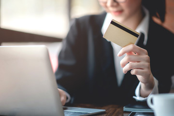 Businessman working on financial business via laptops and credit cards