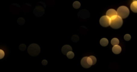 Leinwandbilder - Bokeh light background, gold shine abstract blur flare effect. Golden yellow glitter particle flares with bright glowing shiny bokeh light sparkles on black background
