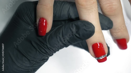 Manicure nail paint red color. Beautiful manicure process. Lerretsbilde