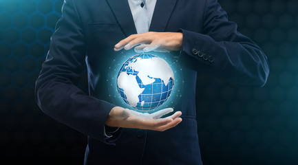 Poster - Global connections in business. Collage with businessman guarding planet Earth on black background, panorama