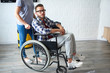 © sata_production - Nurse caring for disabled man in wheelchair