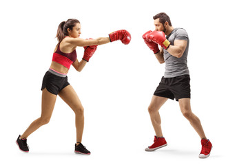 Wall Mural - Man and woman in sportswear fighting with boxing gloves