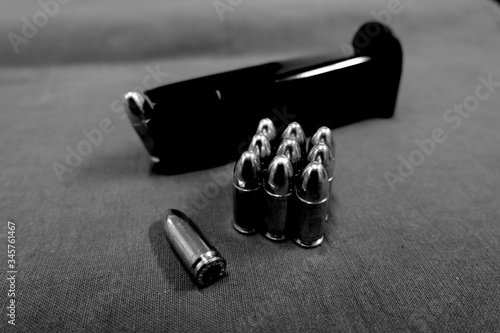 Close-up Of Gun Magazine And Bullets
