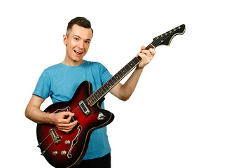 Young guy plays on a retro guitar isolated on a white background.