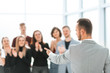 © yurolaitsalbert - blurred image of a group of young people applauding their speak