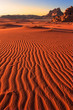Dramatic ripples of sand in the sunrise at Wadi Rum desert, Jordan, with a clear sky and no people