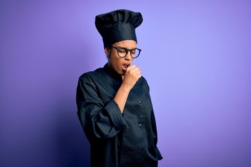 Sticker - Young african american chef girl wearing cooker uniform and hat over purple background feeling unwell and coughing as symptom for cold or bronchitis. Health care concept.