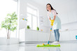 © deagreez - Full length body size view of her she nice attractive cheerful cheery hardworking girl making fast domestic work wiping perfect ceramic floor in modern light white interior kitchen indoors