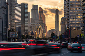 Wall Mural - Traffic on city streets and overpasses, with skyscrapers in the  in the background