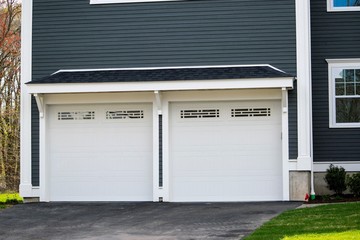 Wall Mural - Two cars Garage Door painted in White color in a typical single house