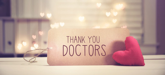 Wall Mural - Thank You Doctors message with a red heart with heart shaped lights