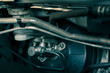details of car engine, brake booster and master cylinder, brake system components in modern car, shallow depth of field