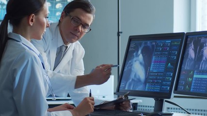 medical doctors working in hospital office making computer research. medicine, healthcare and techno