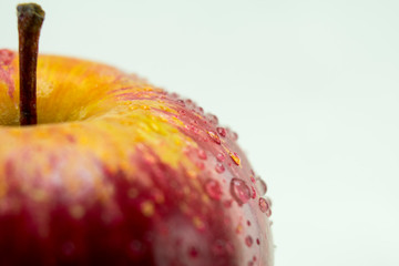 Isolated Apple on white closeup with Dew