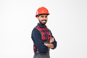 Happy indian engineer wearing helmet, isolated on white background.