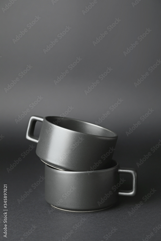 Blank cups on dark background