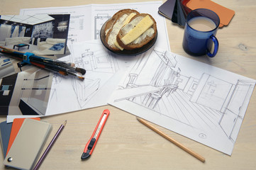 interior sketches, bedroom, living room, kitchen. The designer draws a project and selects materials, on the table are outline drawings and samples of materials. A glass coffee mug.