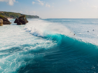 Canvas Print - Surfing waves in ocean and shore. Aerial view of surf spot in Bali