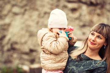 Happy family young caucasian mother and daughter having fun outdoor