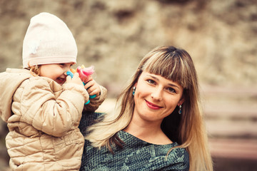 Happy family young caucasian mother and daughter having fun outdoor