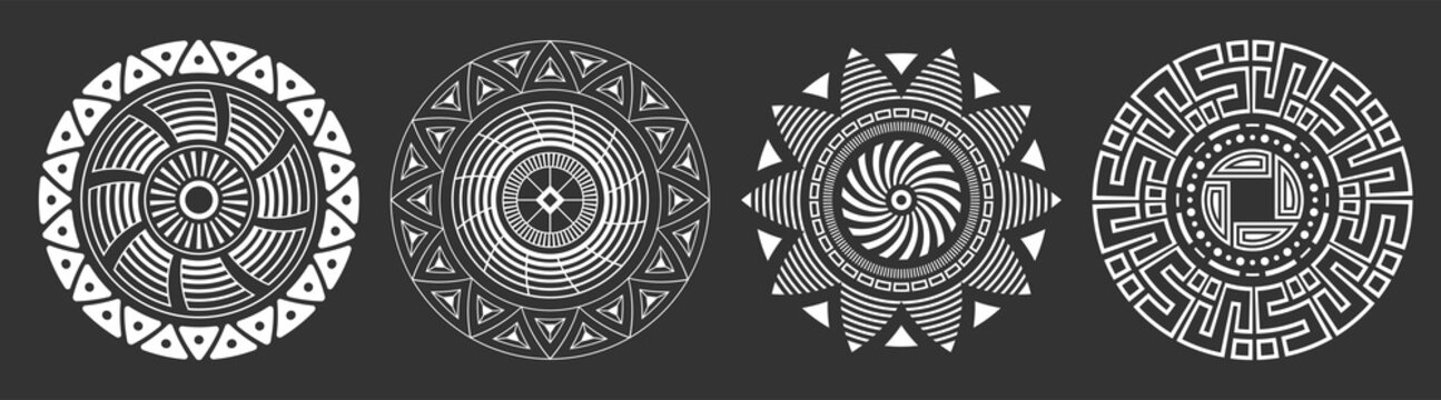 set of four abstract circular ornaments. decorative patterns isolated on black background. tribal et