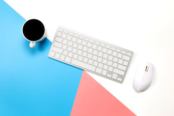 Wall Mural - flat lay Office desk table of modern workplace with laptop on blue pink and white background, top view laptop background and copy space on black background, 