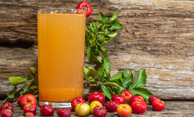 Natural juice of acerola (Malpighia emarginata). Tropical fruit. Drink based on aceroleira fruits. Glass. Refreshing drink. Fruits and drinks from Brazil.