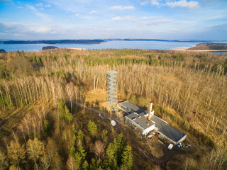 Poster - Aerial view of observation tower located on terrain of German Land Forces Headquarters from ww2 hidden in a forest in spring season in Mamerki, Poland (former Mauerwald, East Prussia)