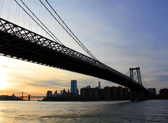 New york, USA - 20/12/2019: williamsburg bridge in New York Manhattan skyscrapers behind at sunset - stock photo