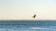 © Viacheslav - Man kitesurfer rides kite jumping. Black Sea coast on sunny day. Blagoveshenskaya. Anapa, Russia.
