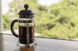 © wachiwit - French Press coffee maker with relaxing tree view